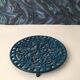 Round cast iron table mat, dark blue