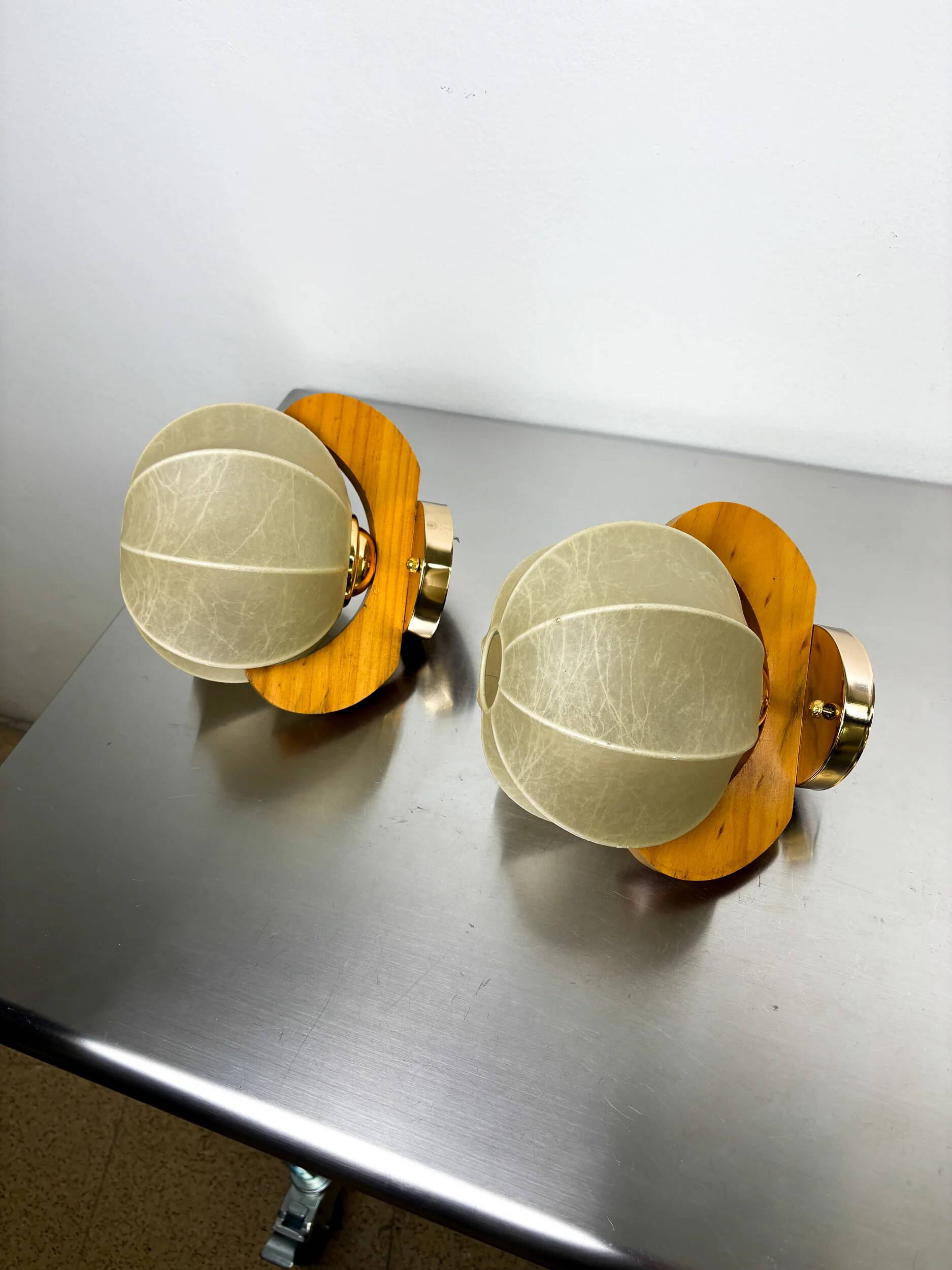 Pair of "Cocoon" wall lights in resin and pine, Italy, circa 1970