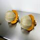 Pair of "Cocoon" wall lights in resin and pine, Italy, circa 1970