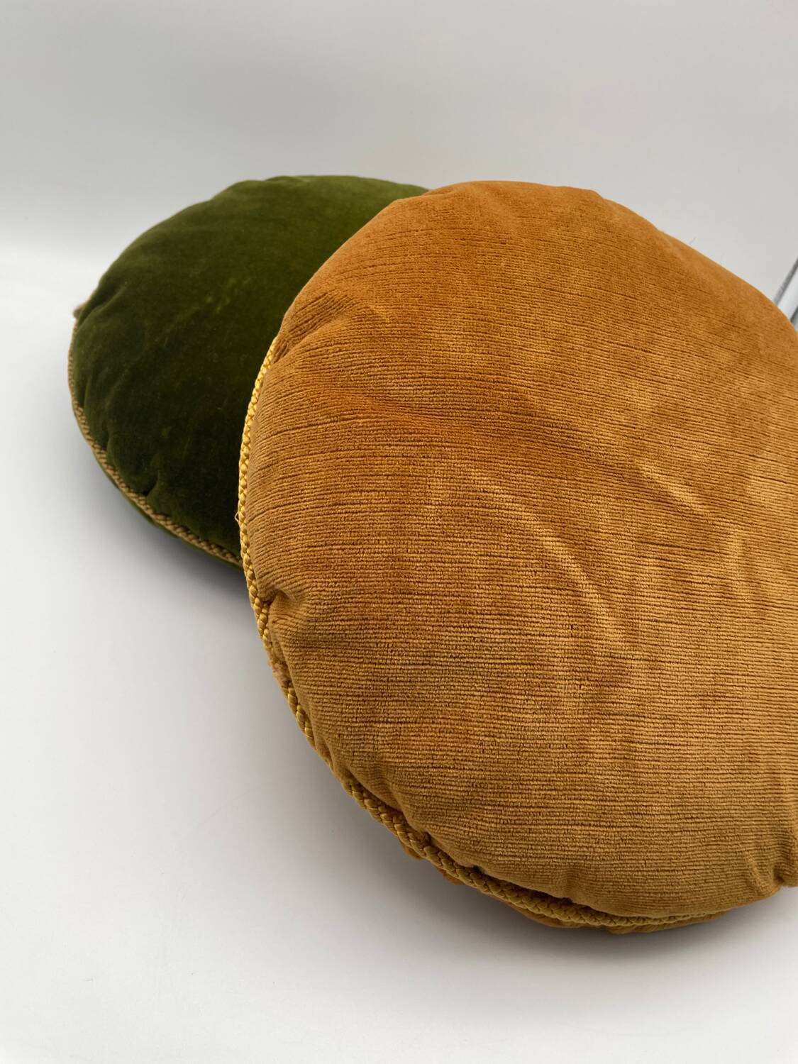 Pair of vintage round velvet cushions