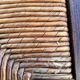 Vintage armchair in straw and brutalist wood