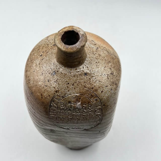 Engraved and square stoneware bottle