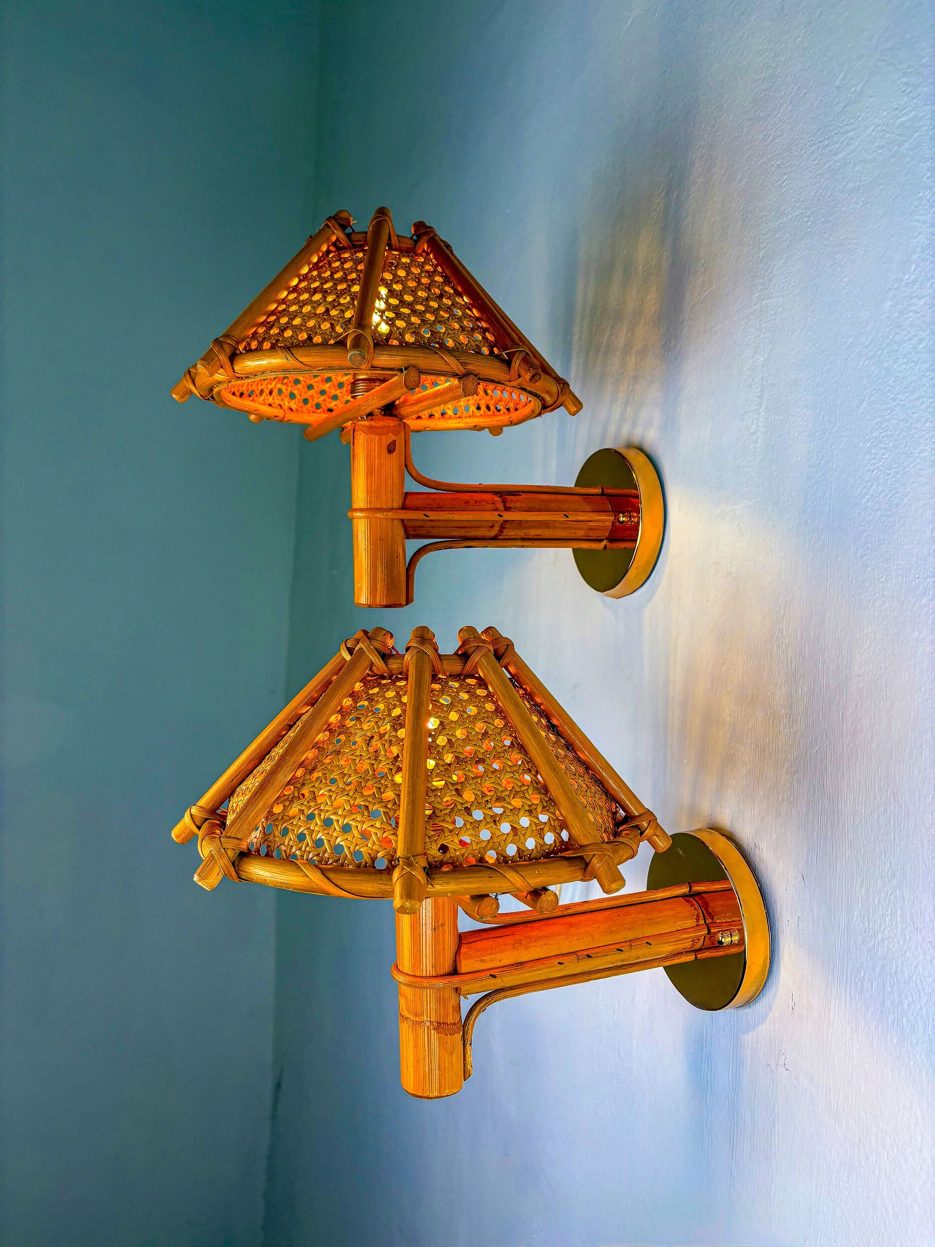 Pair of rattan bamboo wall lights with woven wicker shades, Italy, 1960s