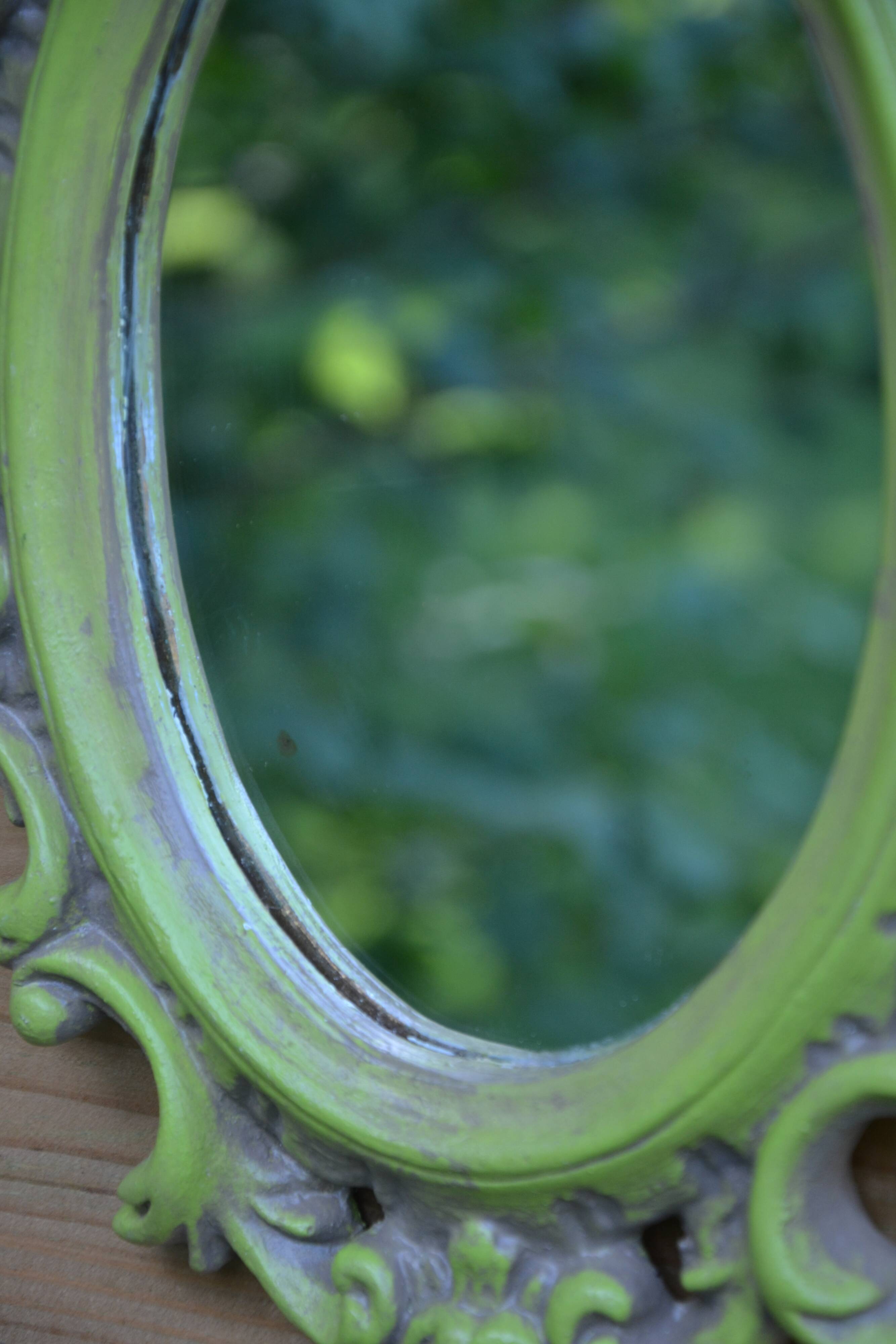 Small green wooden mirror