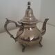 Oriental teapot in silver metal