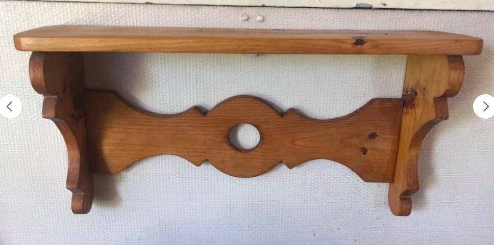 Rustic honey-colored varnished pine shelf