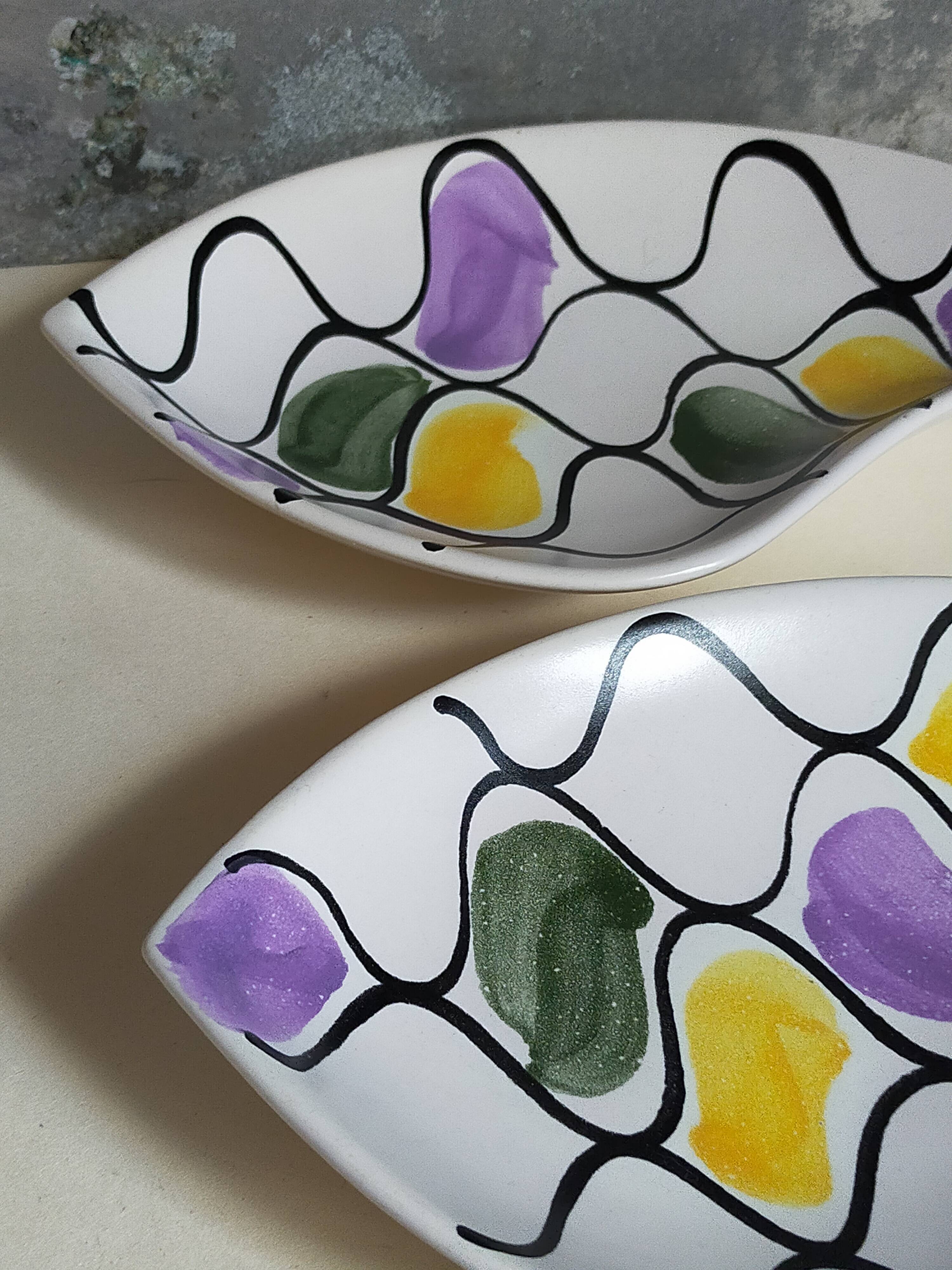 Three vintage free-form ceramic ravine dishes from the 1950s