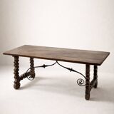 Spanish table in walnut and wrought iron, lyre-shaped base.