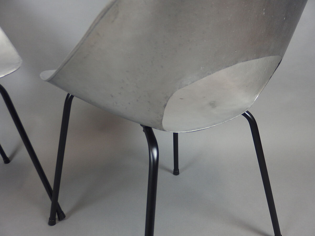 Four aluminium chairs by Pierre Guariche