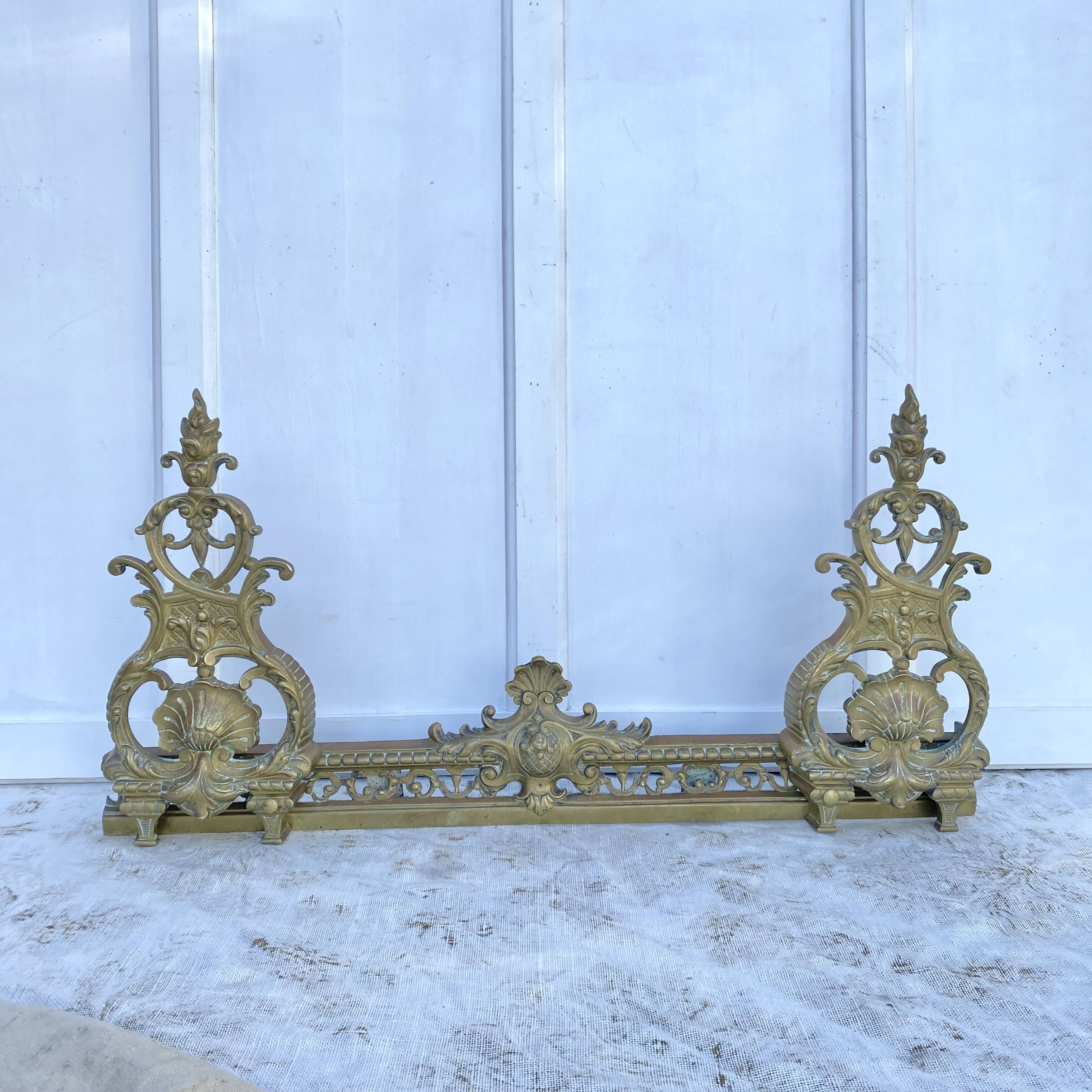 Antique brass fireplace set, bar and andirons, Napoleon I style.