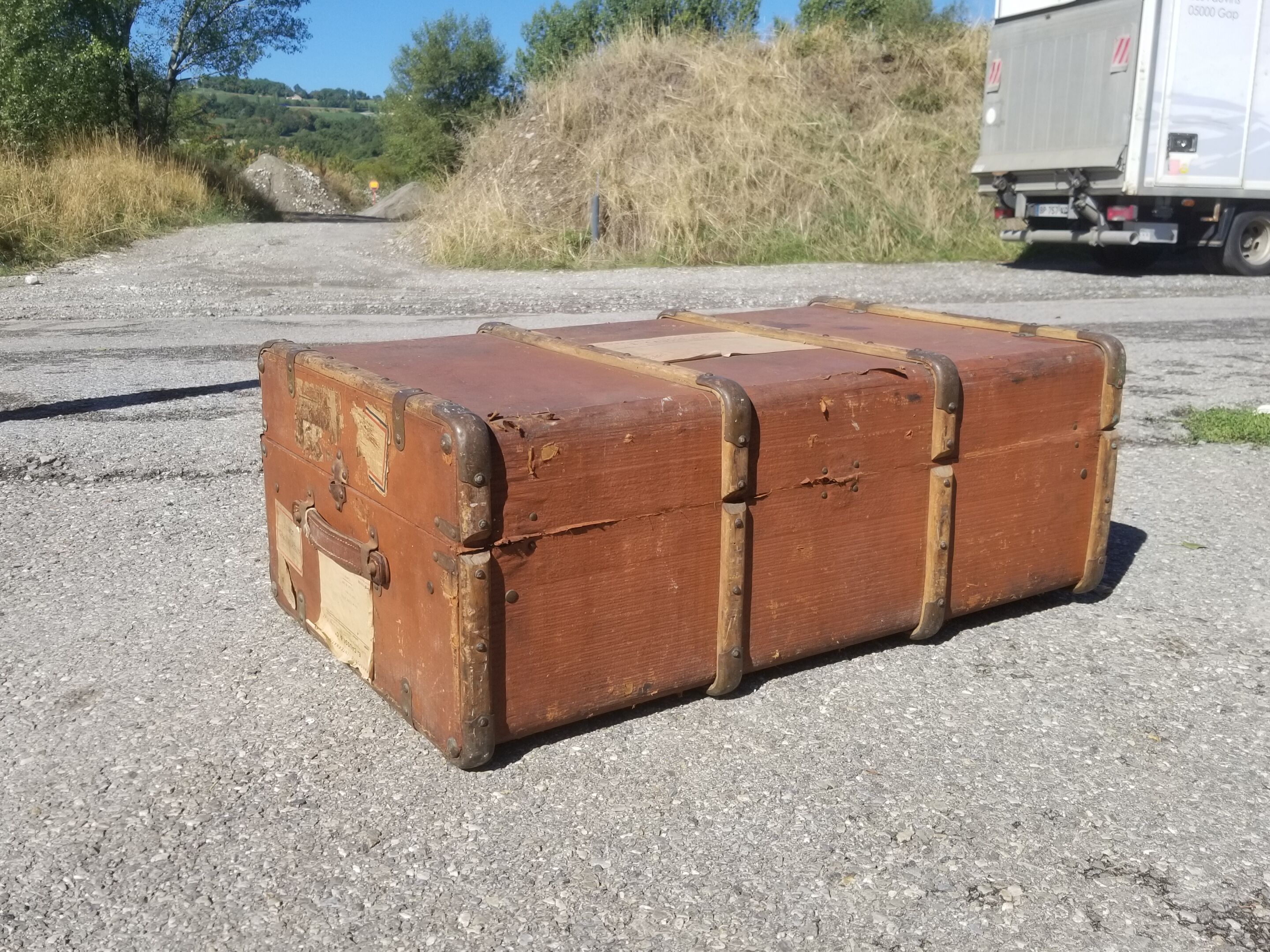 Old travel trunk made of wood and brass