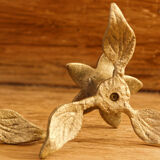 Pair of brass candle holders, flowers