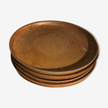 4 flat plates in raw sandstone