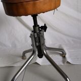 Vintage rotating stool seated in leather and chrome legs