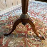 Tripod table with a sculpted top