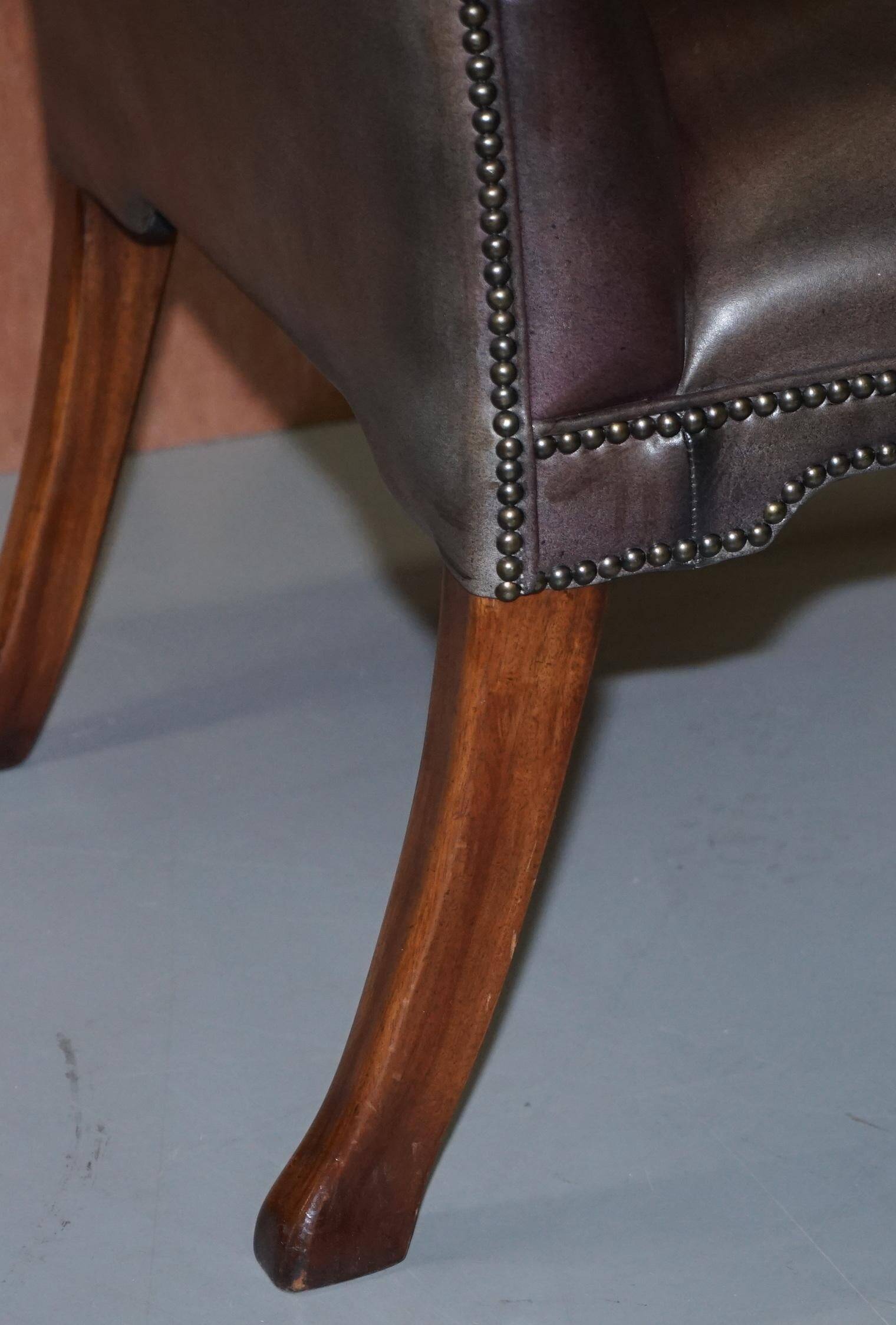 Gainsborough armchair George II leather Chesterfield hand-carved with claw and ball feet.