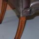 Gainsborough armchair George II leather Chesterfield hand-carved with claw and ball feet.