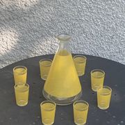 Liqueur set consisting of a glass carafe and 8 small yellow glasses