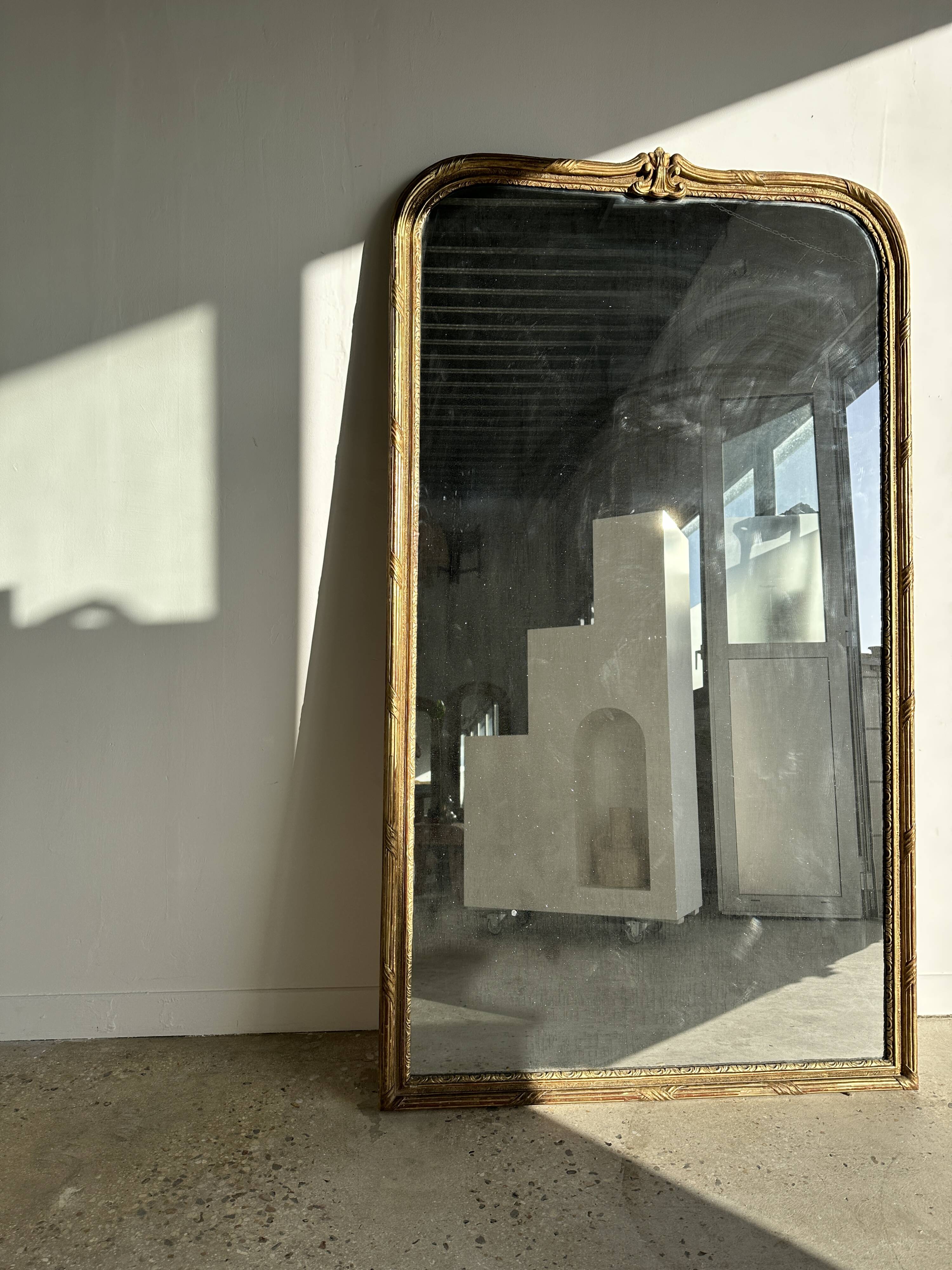 Large gilded mirror 19th century rounded corners mercury glass Louis XVI style
