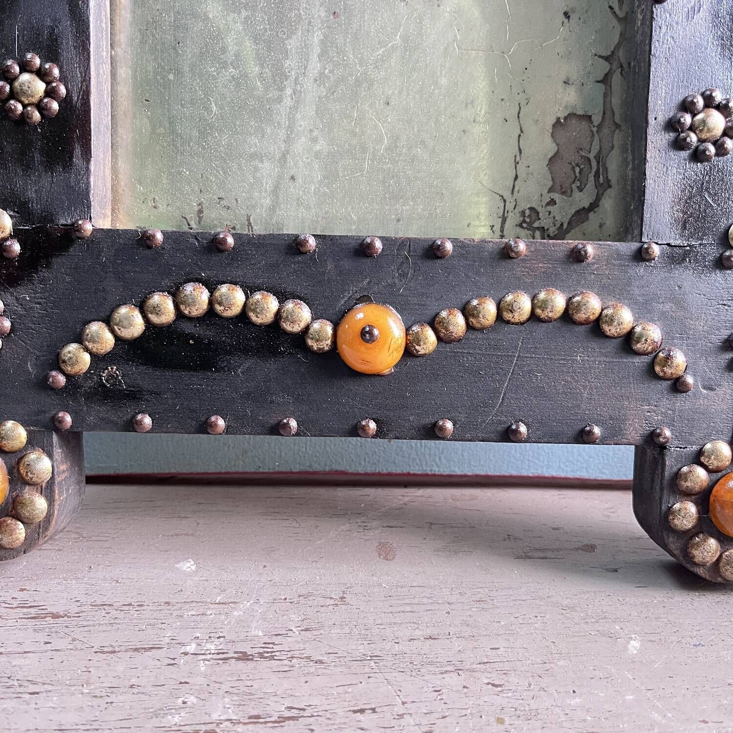 Antique wooden studded mirror