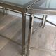 Rare three-part nickel coffee table with lacquered glass tops around the perimeter