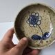 Ceramic bowl emptier with floral motif by suzanne dauliach