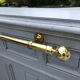 Grey lacquered wooden bar cabinet, golden brass bar