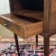 Art Deco bedside table in rosewood, walnut burl, and marble top.