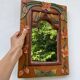 Miroir en bois, sculpté à décor de fleurs