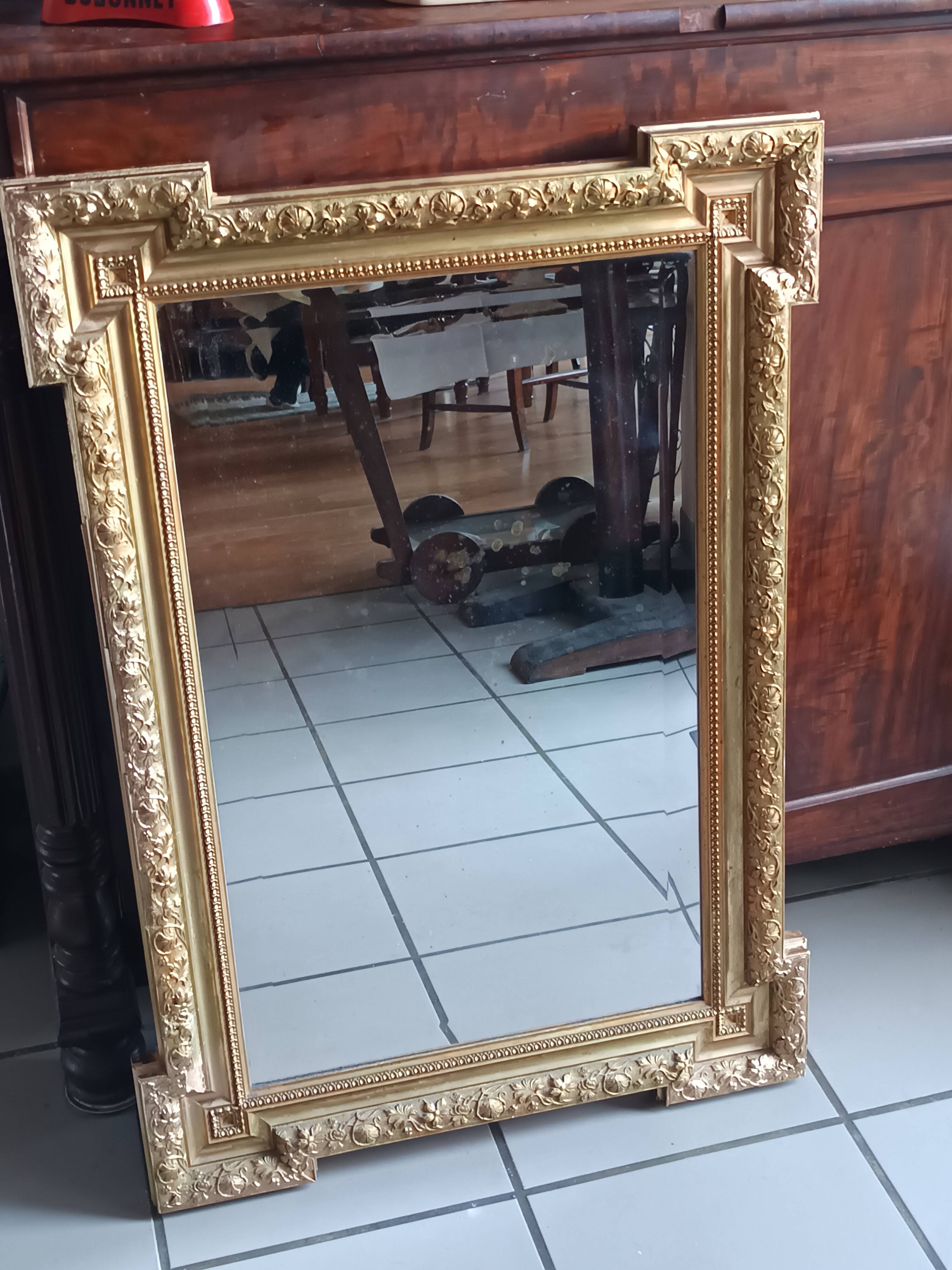 Antique mirror in wood and gilded stucco, neo Louis XVI style.