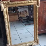 Antique mirror in wood and gilded stucco, neo Louis XVI style.