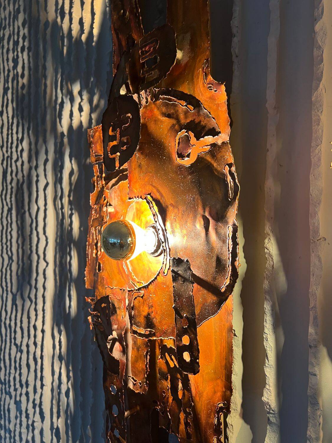 Set of raw expressive wall sconces by Francesco Pasinato