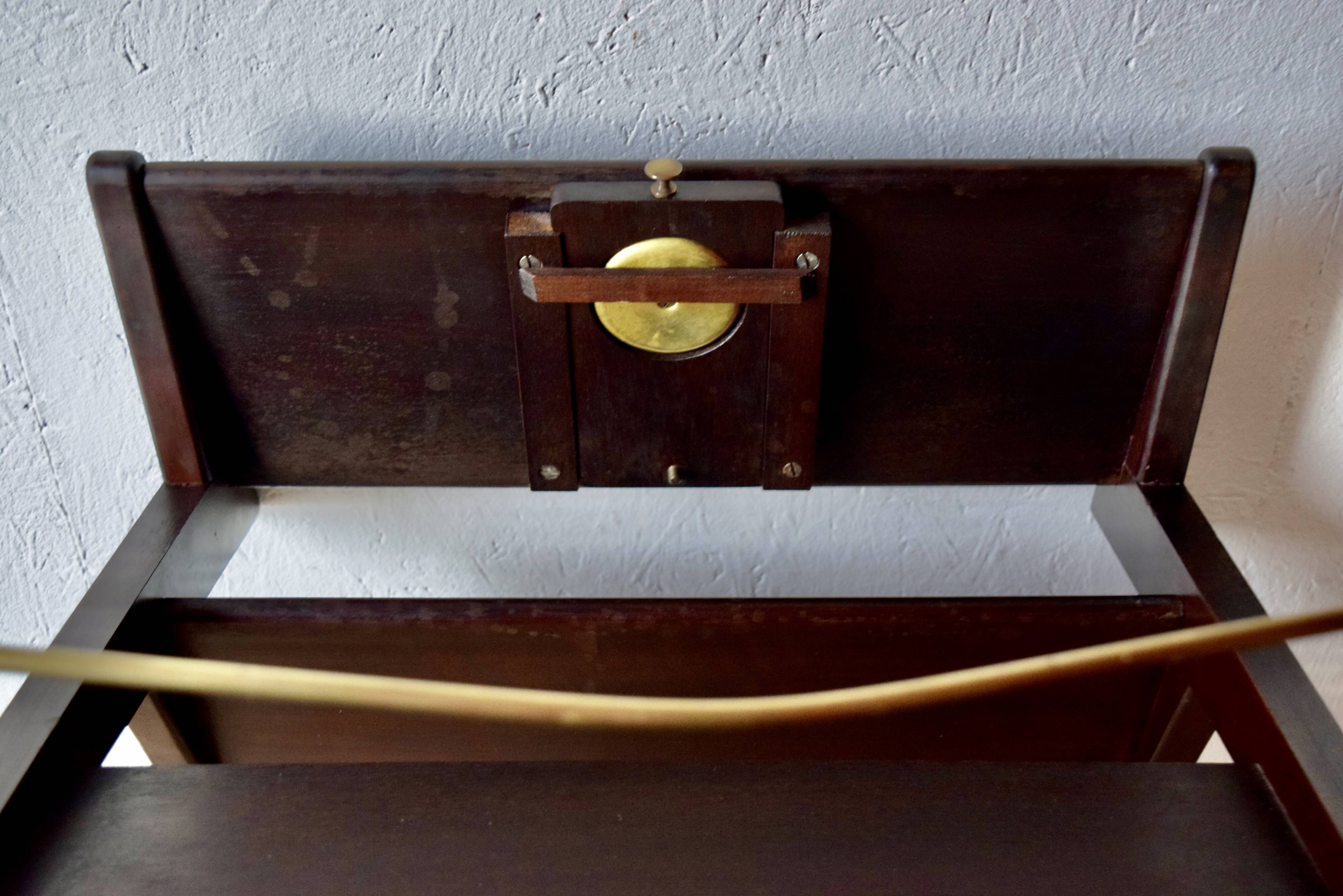 Old Scandinavian style magazine rack in dark wood with integrated brass ashtray