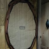 Old oval gilded stucco mirror