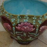Old earthenware cachepot with flower decoration