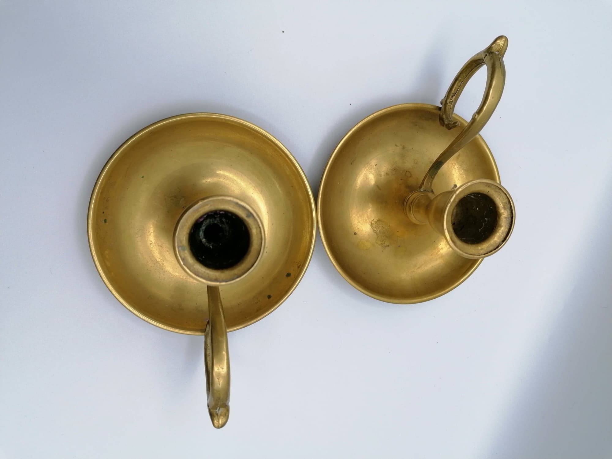 Pair of brass hand candlesticks