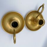 Pair of brass hand candlesticks