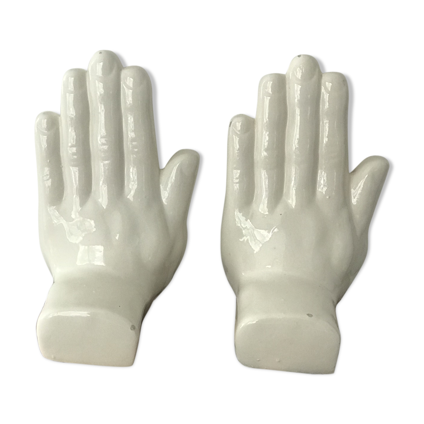 Hands tighten books in ceramics