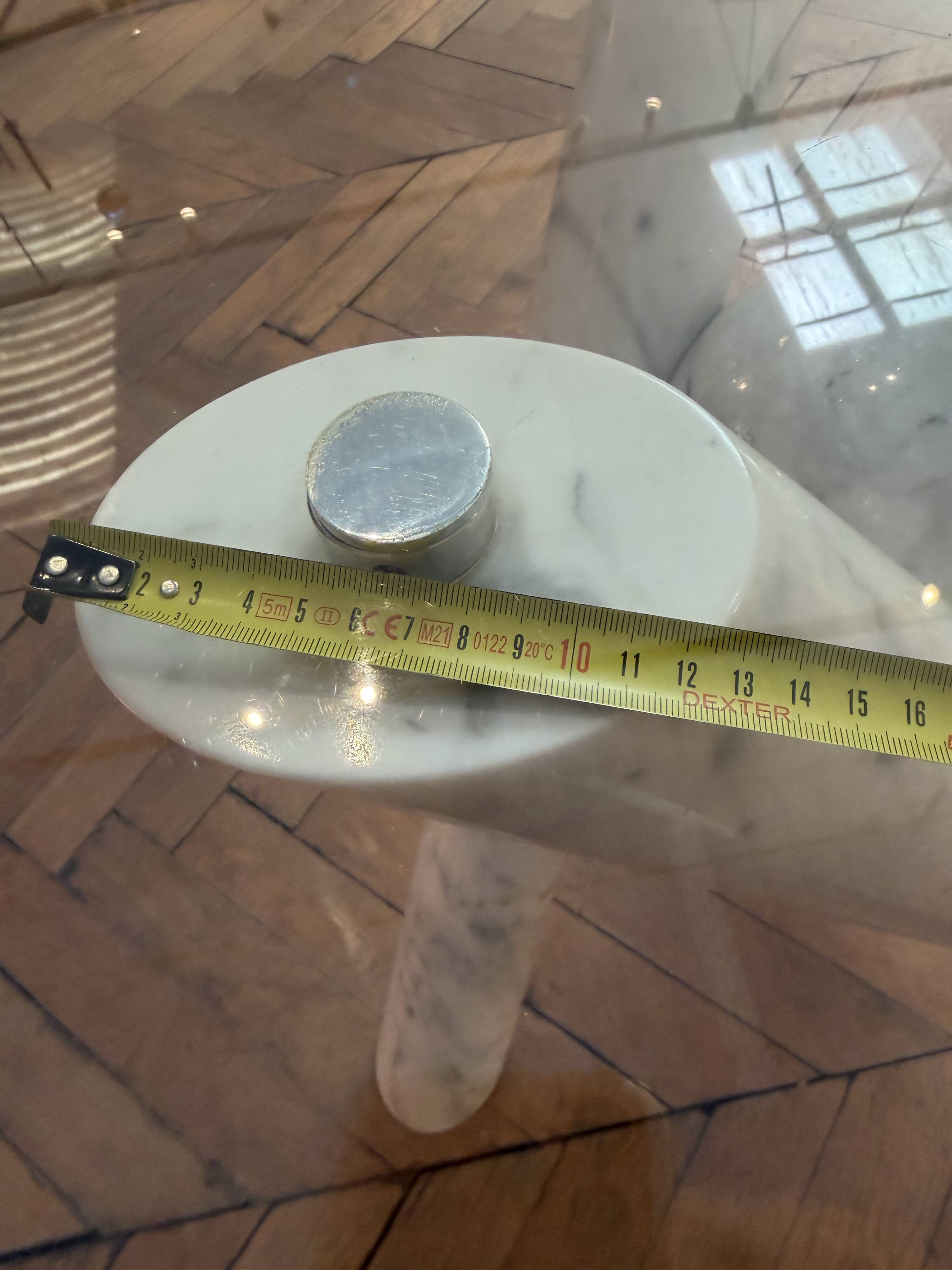 Dining table with glass top and marble base, Ligne Roset.