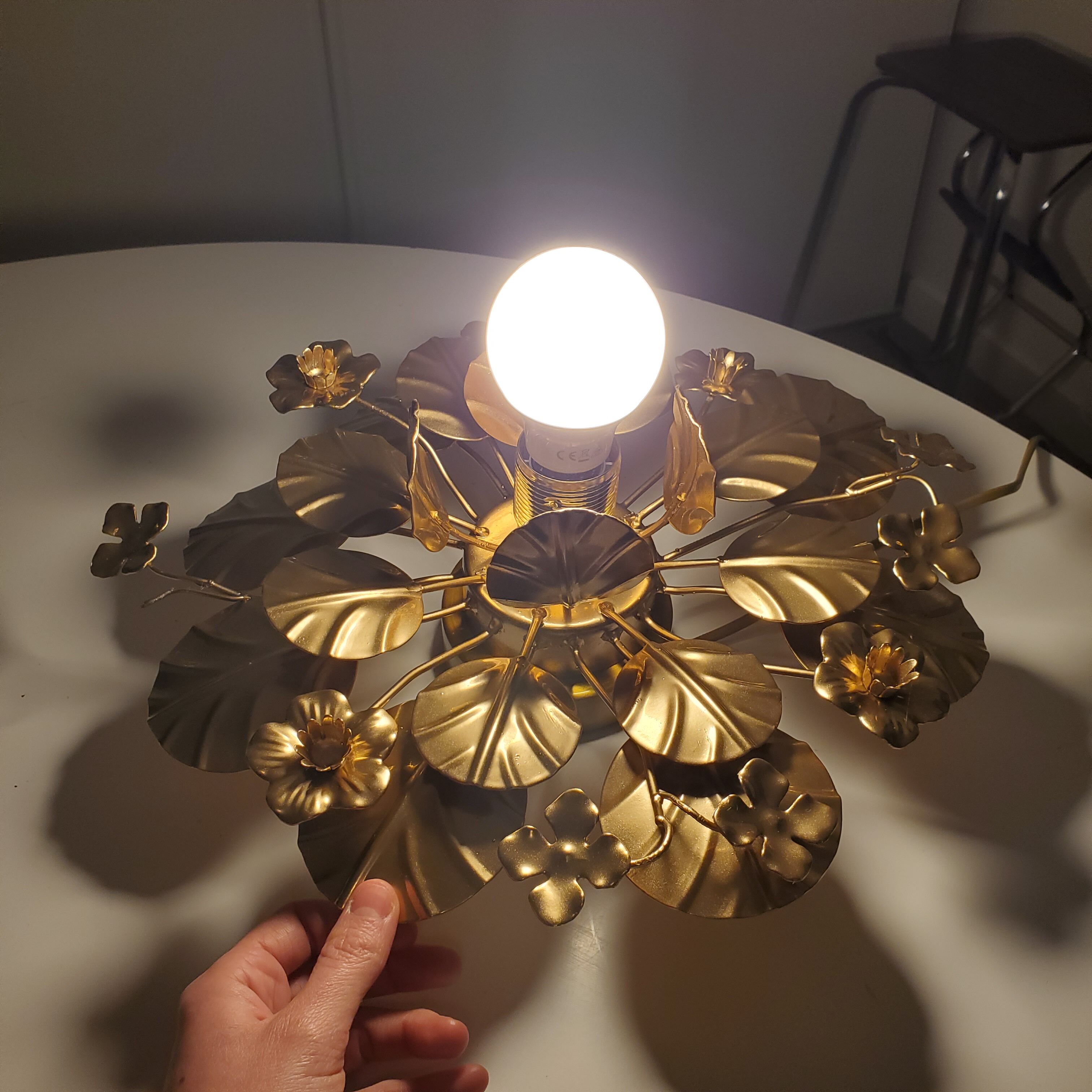Golden metal flower sconces