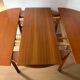 Extendable teak round table