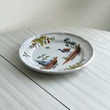 Hand-painted earthenware plate with landscape and bird decoration.