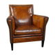 Art deco armchair in sheepskin with black piping and decorative nails