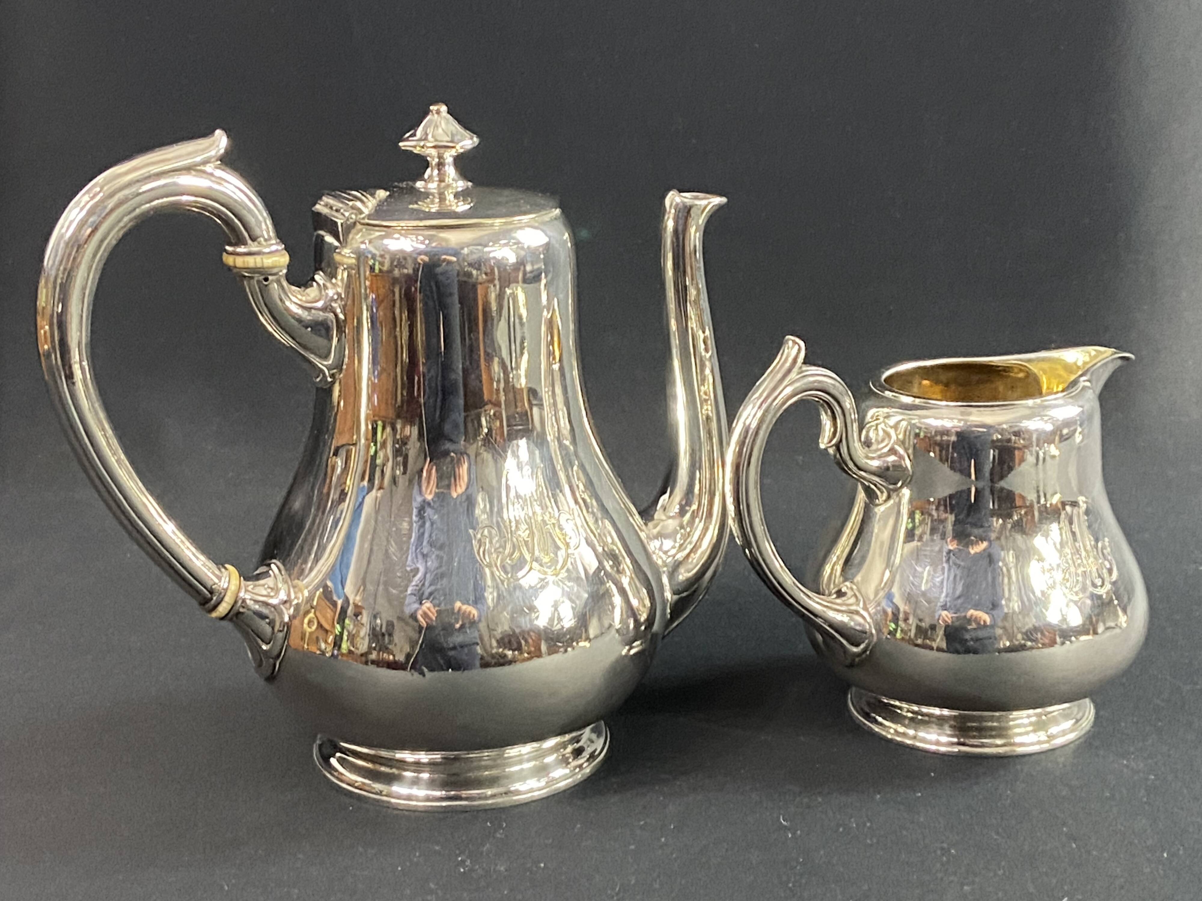 Silver-plated coffee pot and milk jug monogrammed MA, signed CHRISTOFLE.