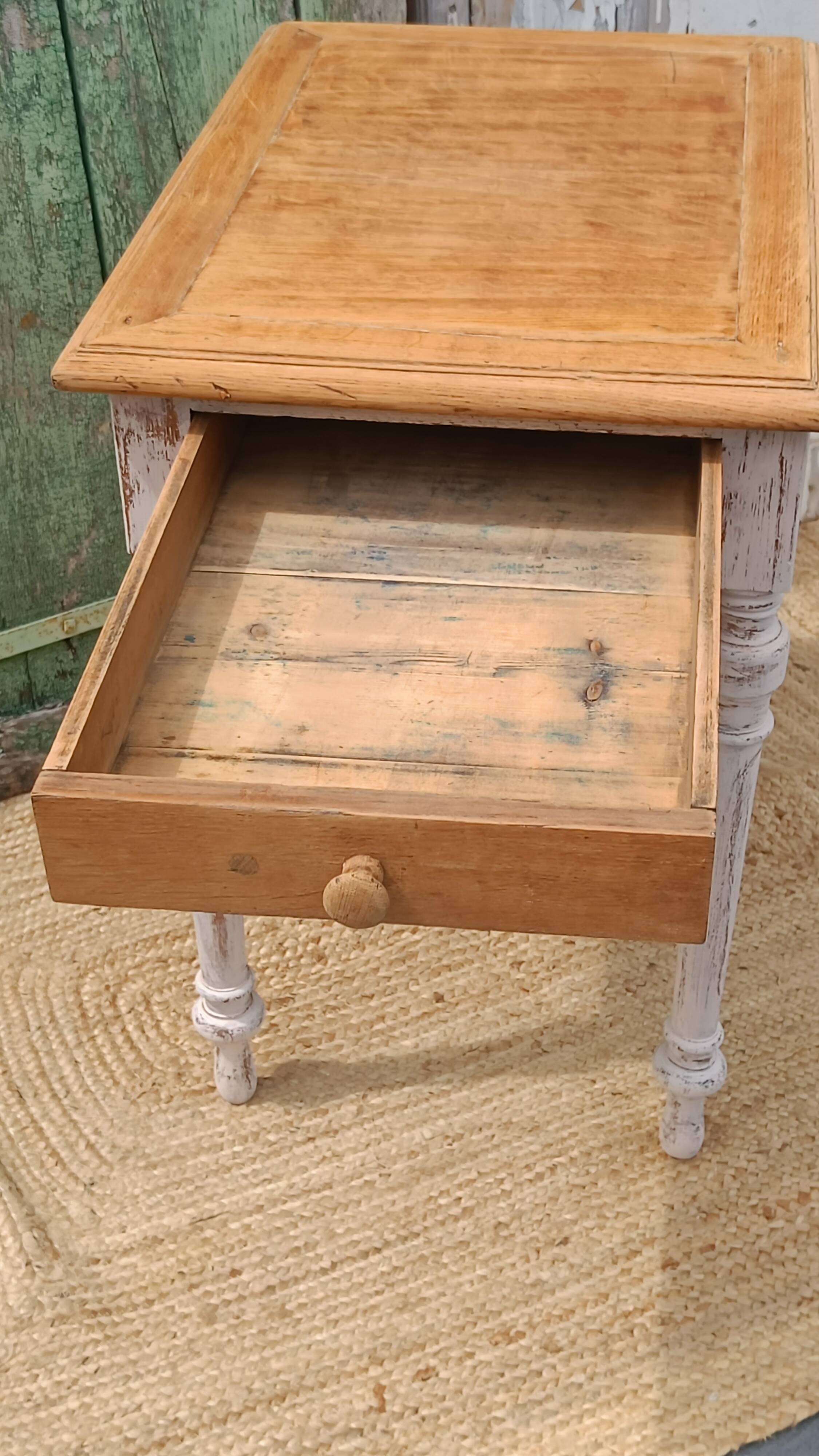 Antique drawer table with a patina.