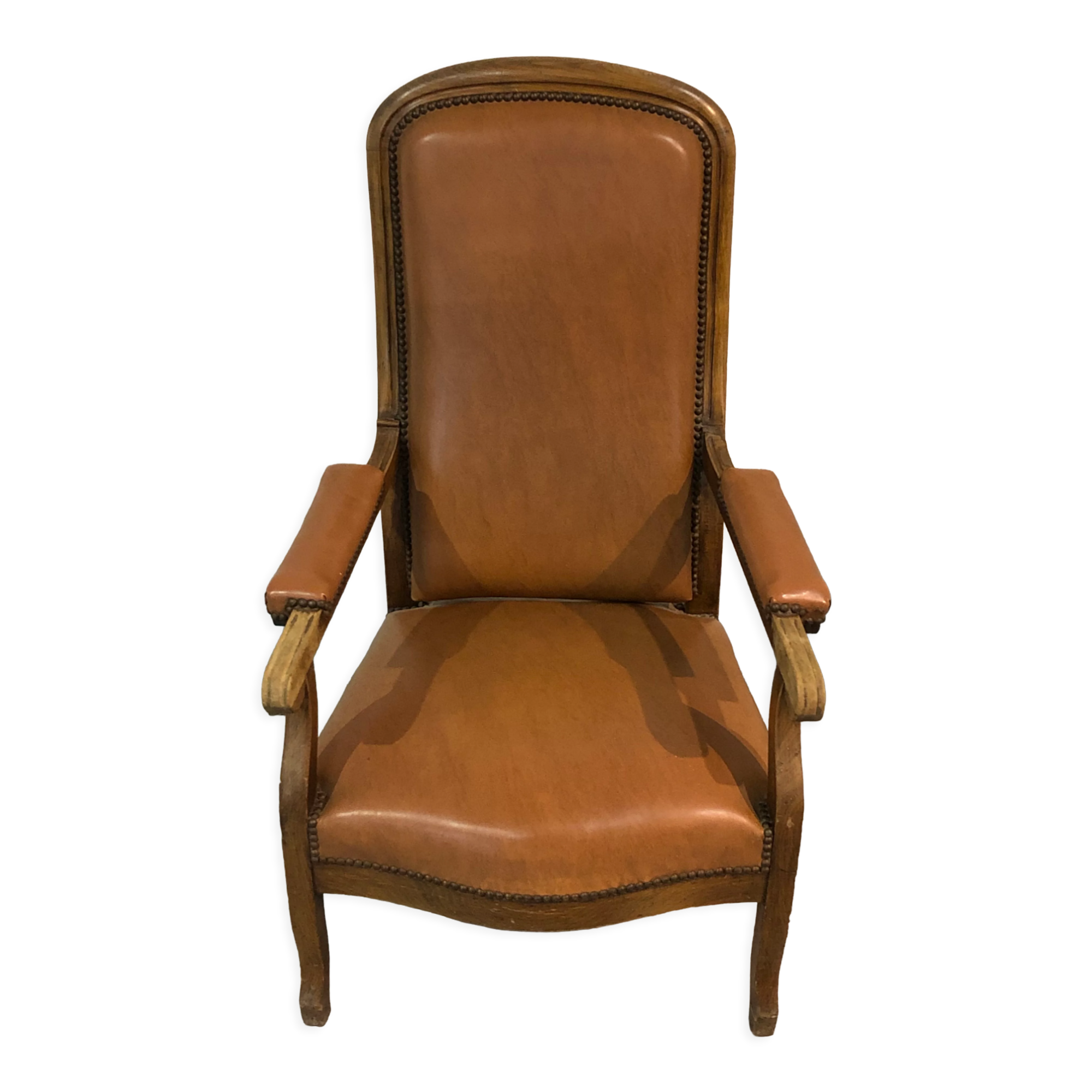 Old Voltaire armchair in light brown leather