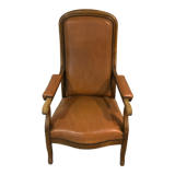 Old Voltaire armchair in light brown leather