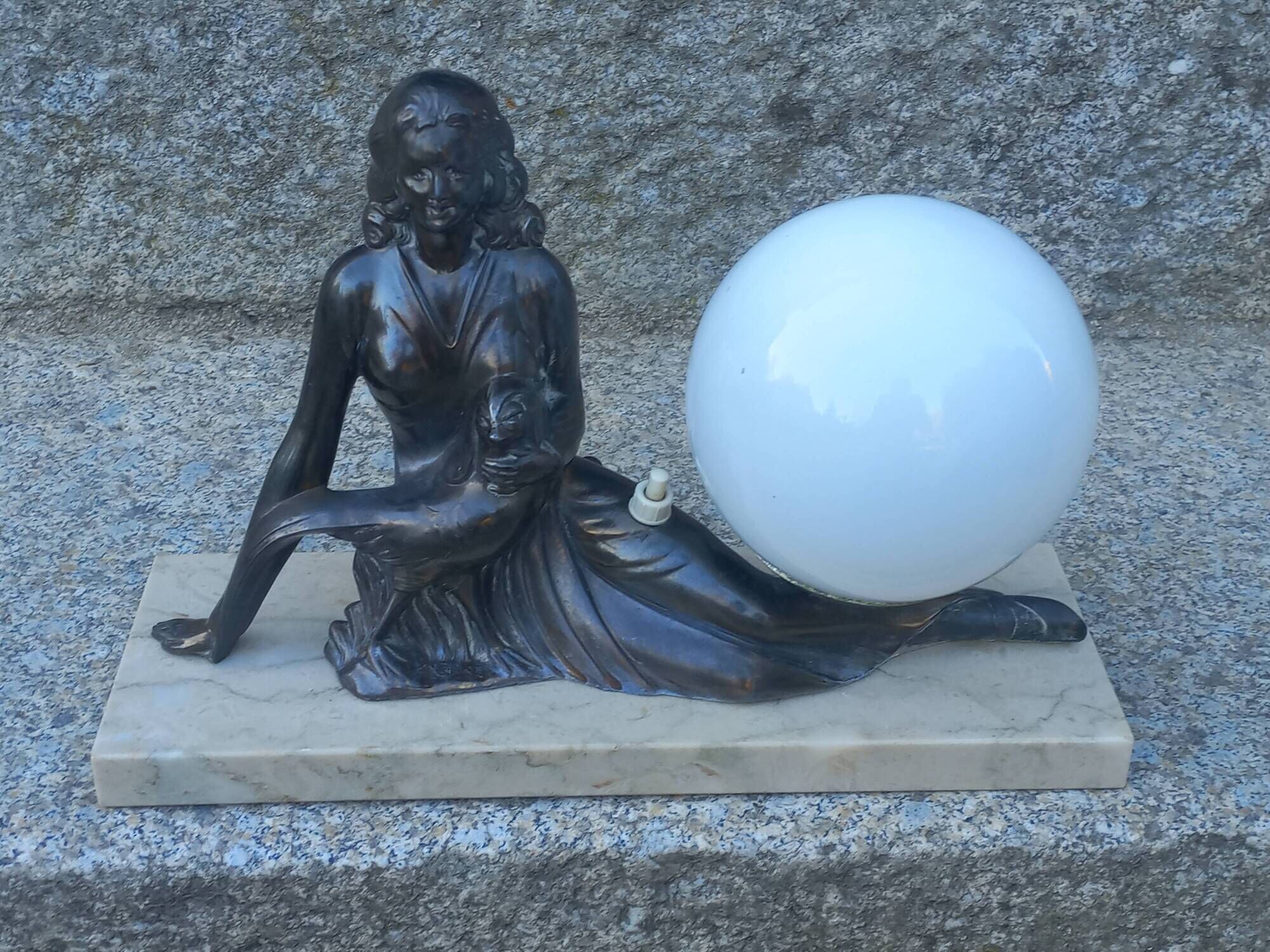 Art Deco lamp in cast iron and marble with a white opaline globe.