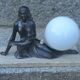 Art Deco lamp in cast iron and marble with a white opaline globe.