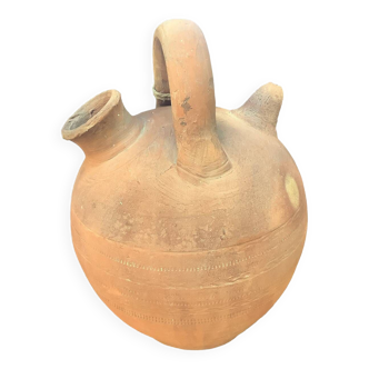 Old terracotta jug called "Gargoulette"
